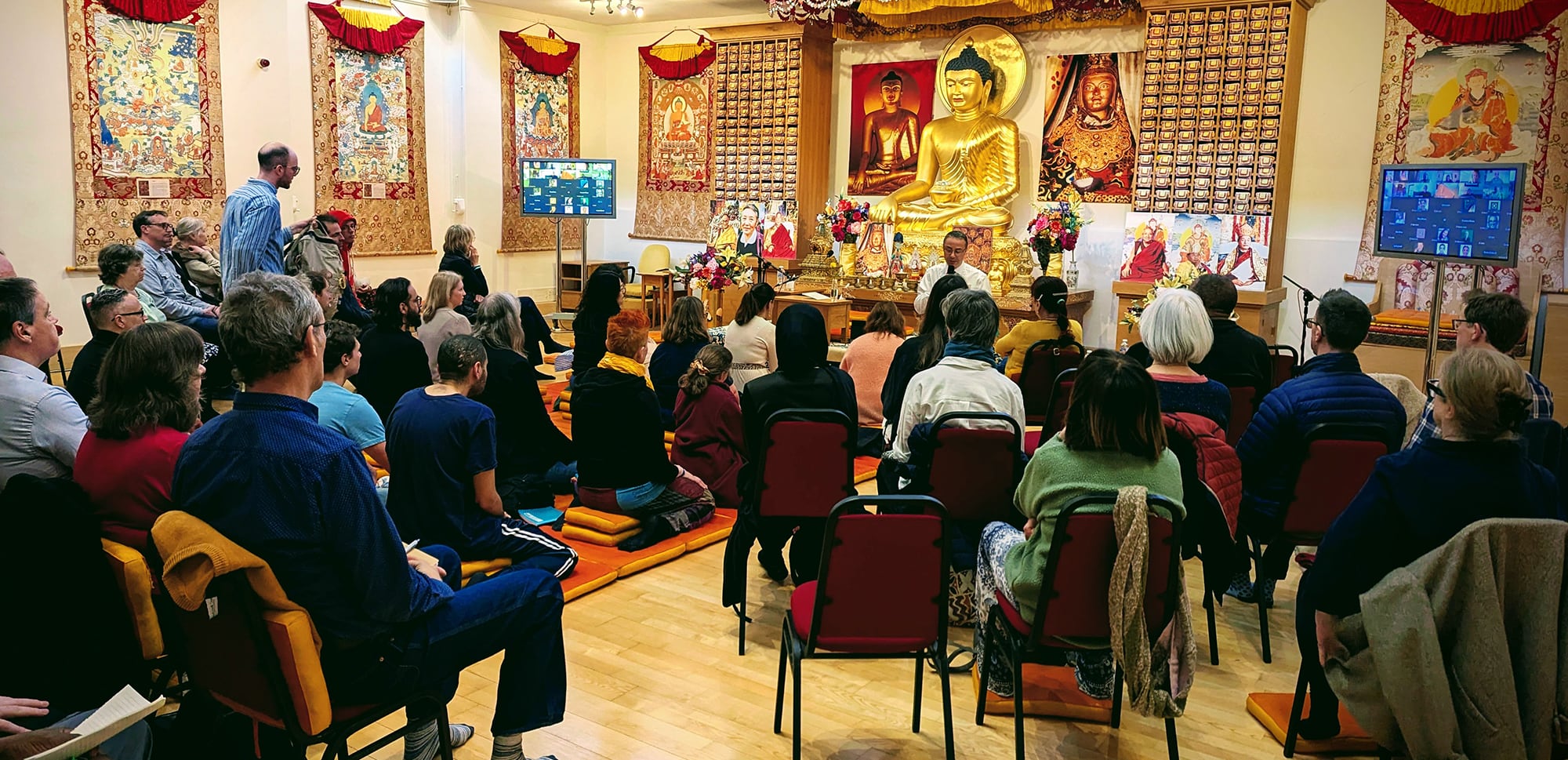 People inside the shrine room at Rigpa London
